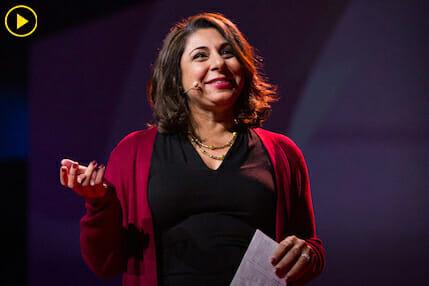 Dolly Chugh presents on stage at TED Boston Consulting Group