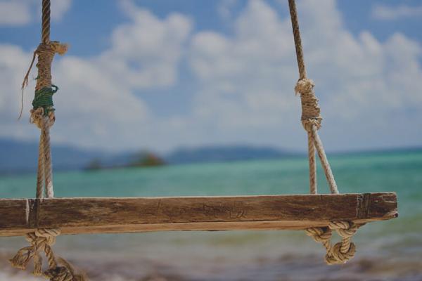 handmade bench in front of the ocean, signifying trust