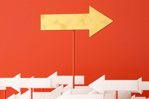A yellow arrow pointing to the right in front of a red background. There are smaller white arrows pointing to the left in the foreground