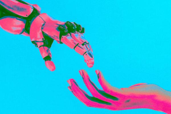 Pink and blue robot hand reaching out to a human hand