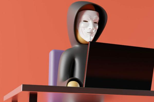 A doll wearing a Guy Fawkes mask and a hoodie in front of an orange background, implying its a hacker and the organization needs cybersecurity