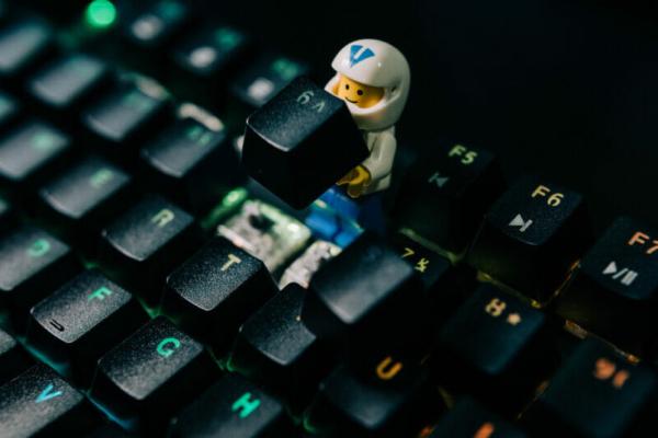 A little LEGO figure helping to repair a computer keyboard
